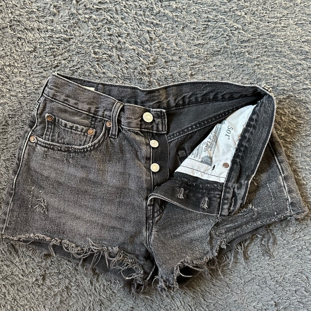 Levi’s 501 faded black distressed button fly shorts, size 26